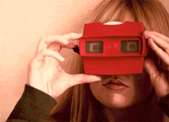 A person using a View-Master reel